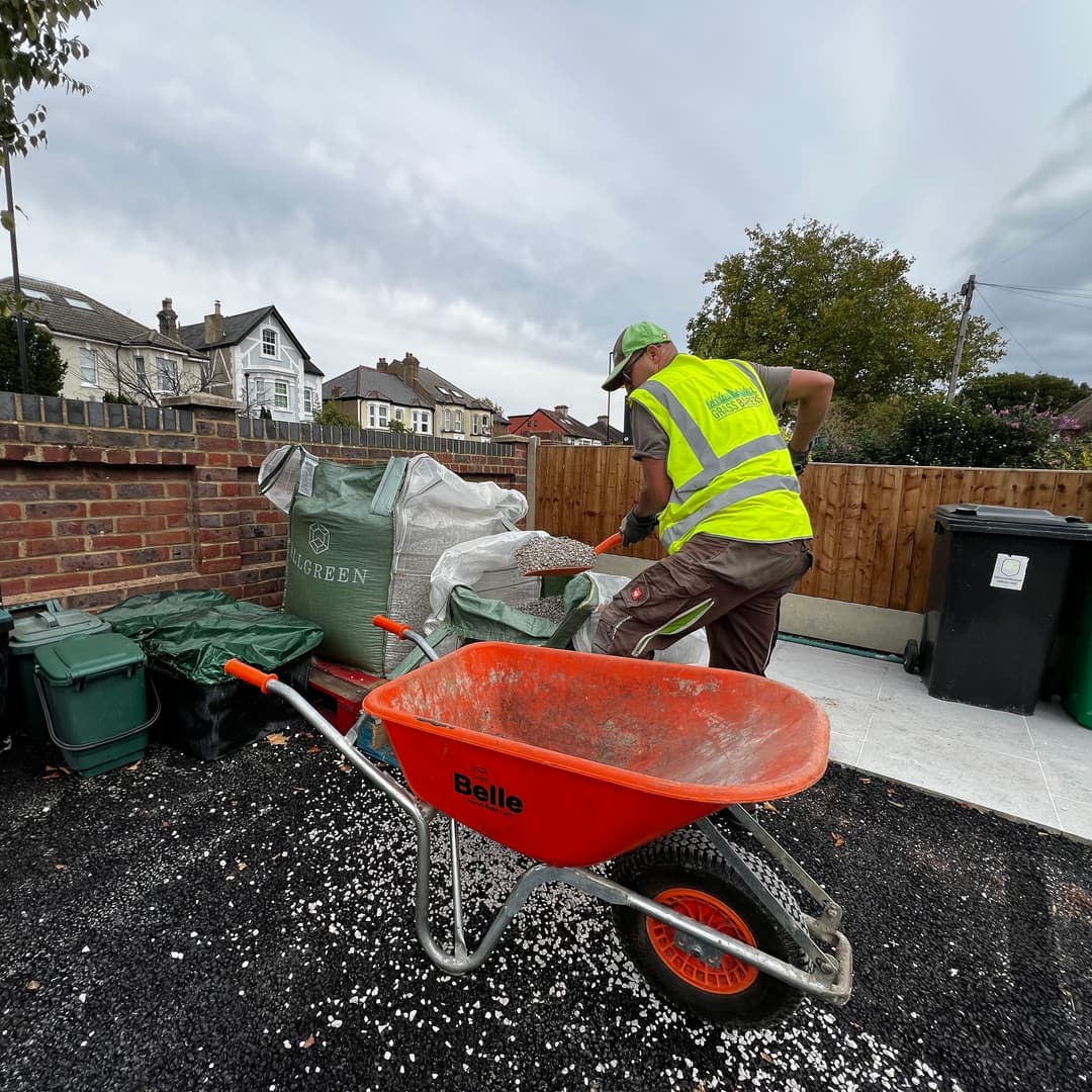 Uneven and waterlogged garden site in London before technical groundworks and drainage installation