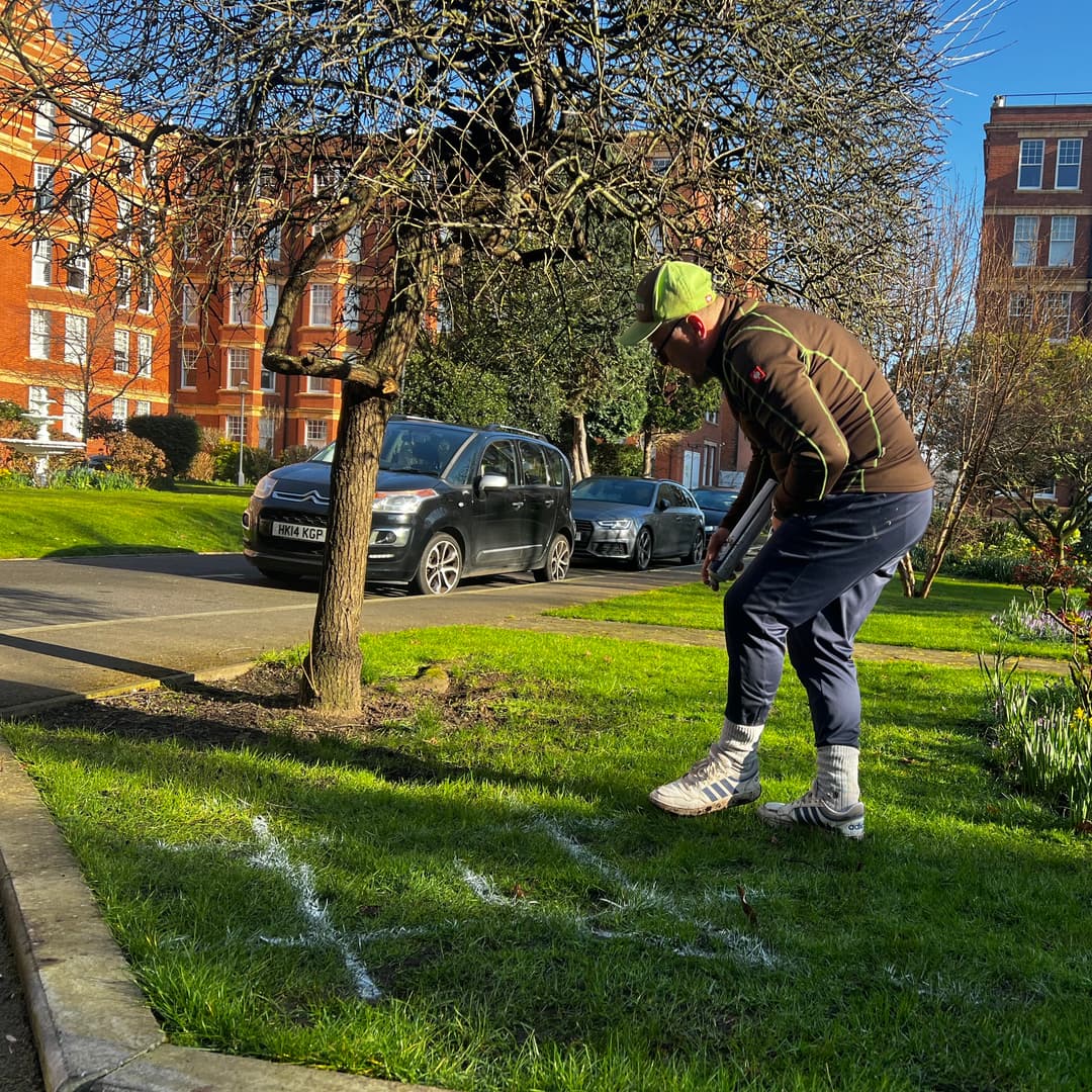 Completed hard landscaping featuring high-finish paving, reinforced sleeper beds, and new boundary fencing