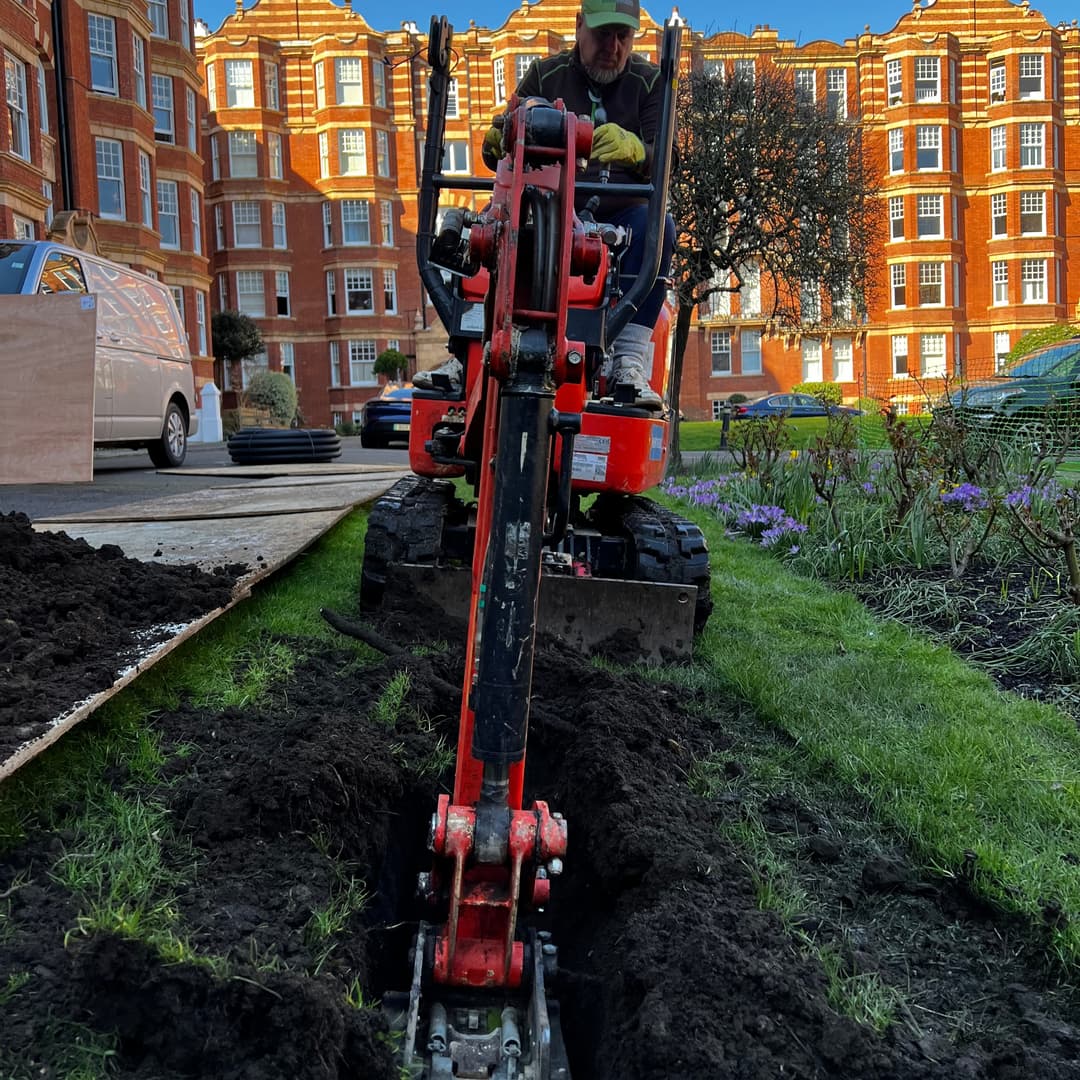 Damaged concrete surfaces and failing boundary structures before hard landscaping restoration