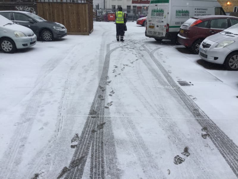 Commercial road blocked by snow and ice before professional clearance
