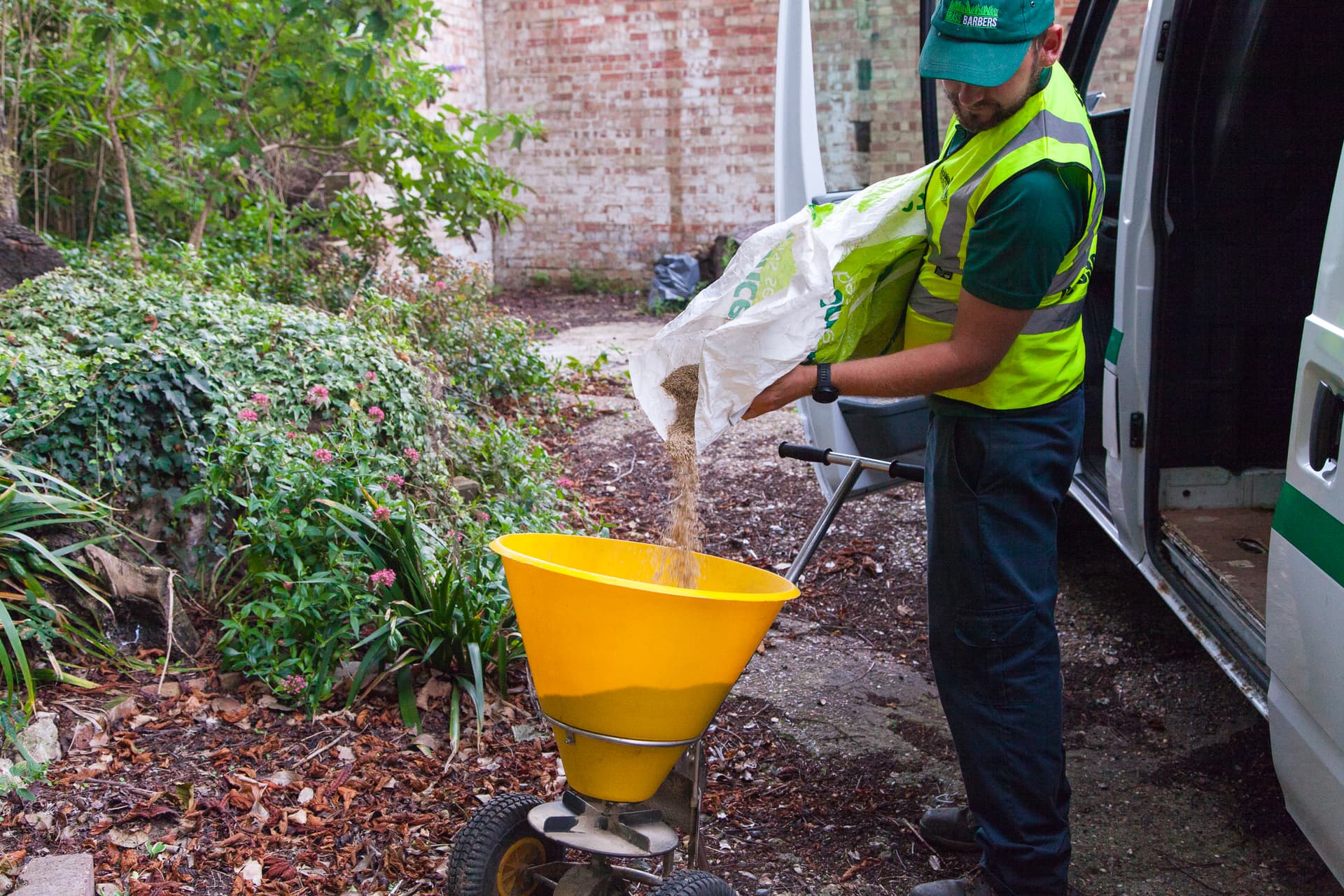 Grass Barbers specialist performing professional lawn scarification